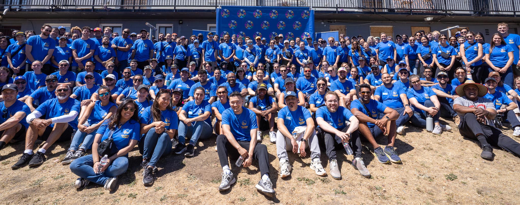 Warriors employees sitting on a beach.
