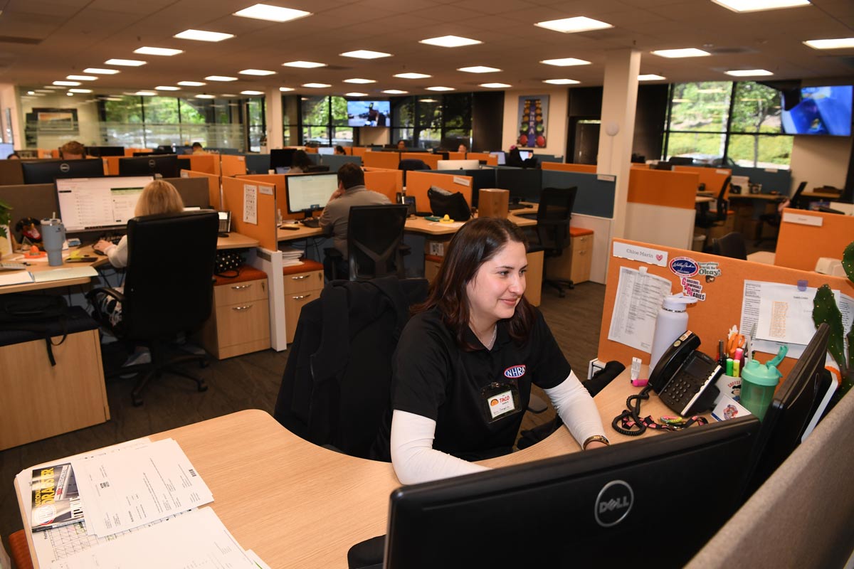A view of hte inside of the NHRA offices with employees working at cubicles