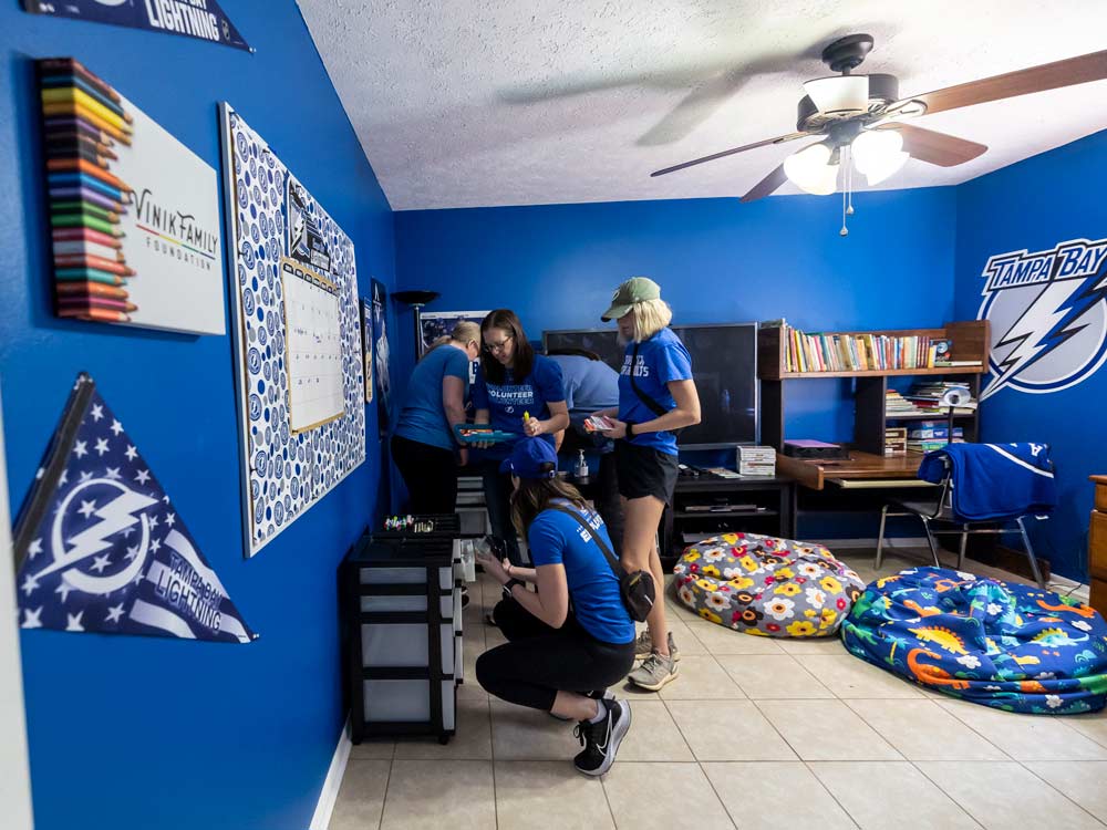 Three women volunteering in an office 