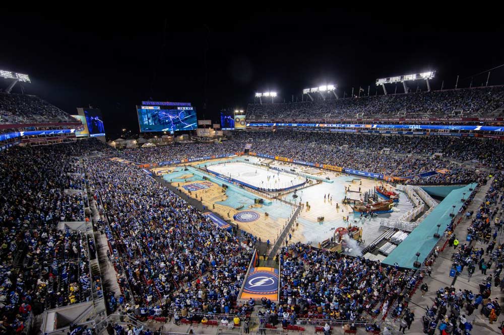 An overhead view of Raymond James Stadium with a full crowd in the stands