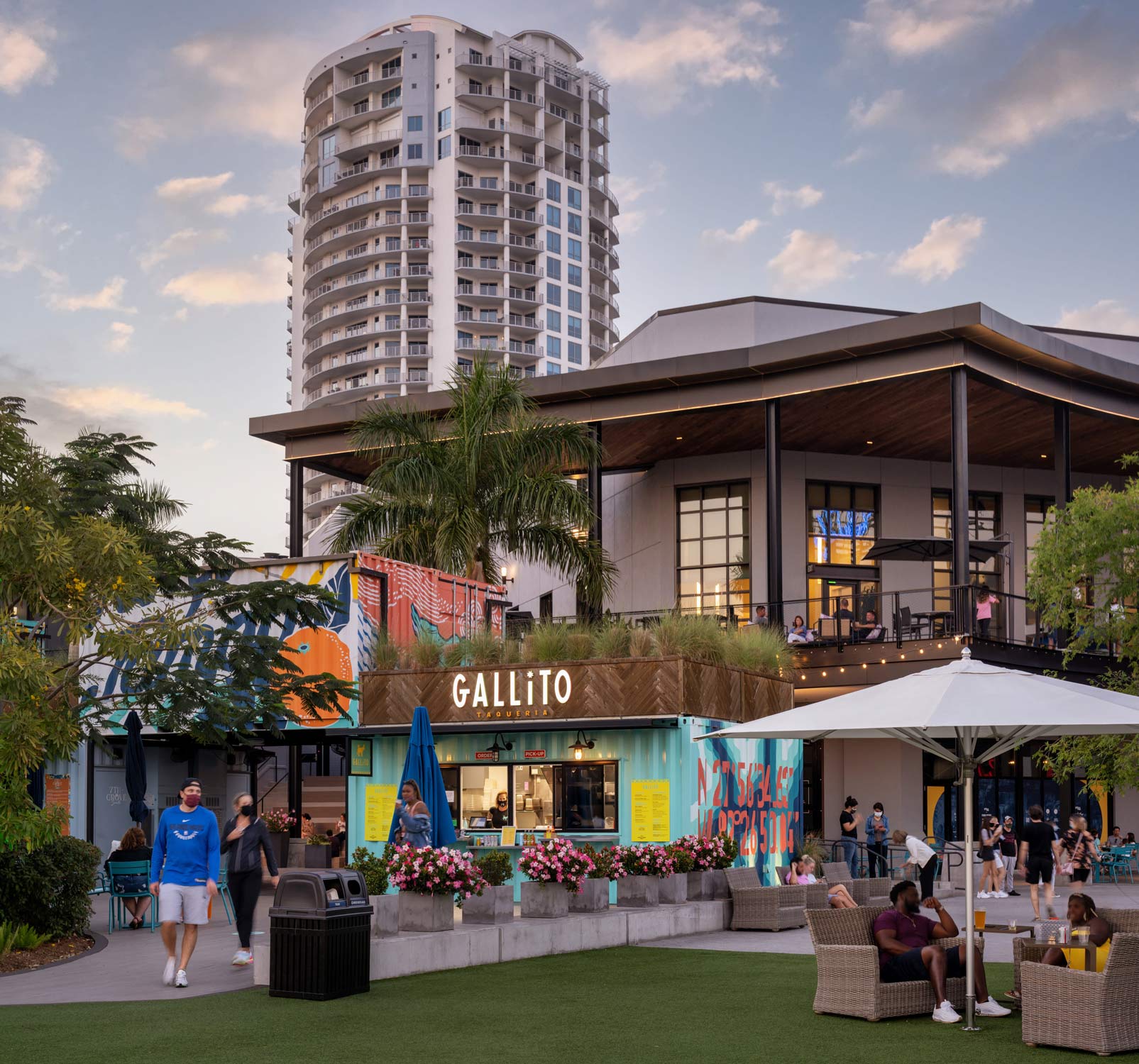 People enjoying the Sparkman Wharf restaurants outside